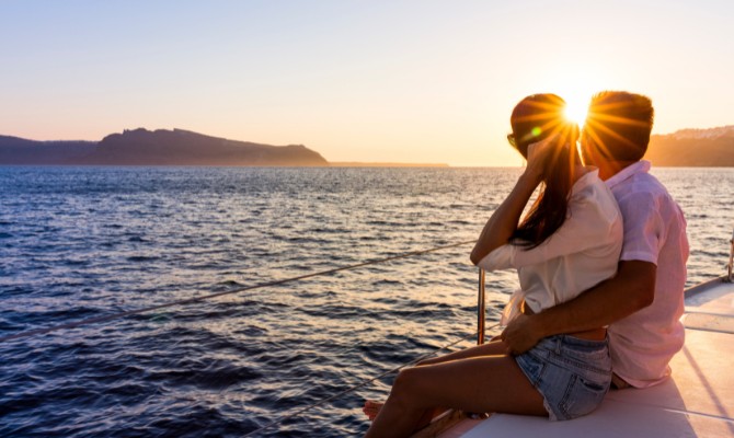 Couple on sunset sailing