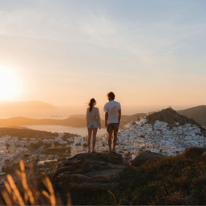 Couple looking at Ios sunset