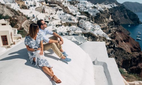 Santorini Serenity: A Couple Facing the Caldera