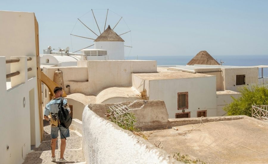 Man walking down street in Santorini