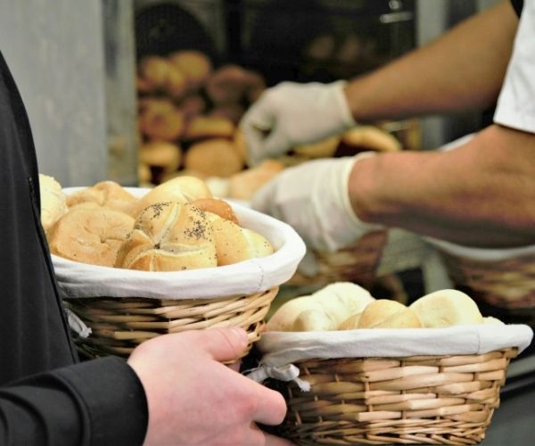 Man holding bread basket