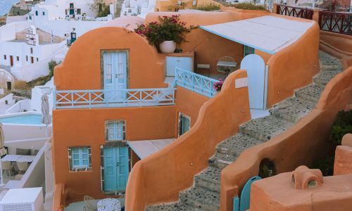 Colorful Santorini Architecture, Whitewashed Forms and Vibrant Island Accents