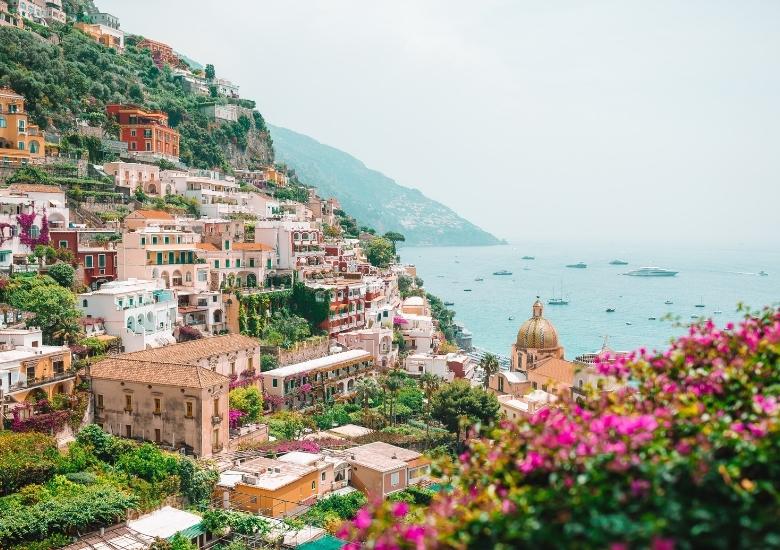 Flowers and houses on Italian cliff